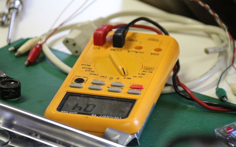 Testing voltage with a digital multimeter.