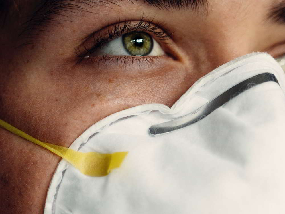 Close-up of a female portrait with respirator mask.